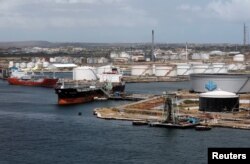 Crude oil tankers are docked at Isla Oil Refinery PDVSA terminal in Willemstad on the island of Curacao, Feb. 22, 2019.