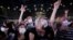 Thousands of concertgoers, masked and tested for the virus, pack AccorHotels Arena in Paris as part of a public health experiment to prepare the country to host big events again, in Paris, May 29, 2021. 