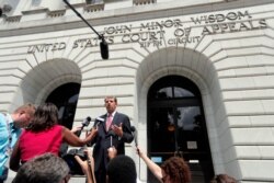 FILE - Robert Henneke, general counsel and director for the Center for the American Future, speaks outside the 5th Circuit Court of Appeals in New Orleans, July 9, 2019. The court struck down the law's rule that Americans have health insurance.
