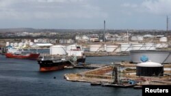 FILE - Crude oil tankers are docked at Isla Oil Refinery PDVSA terminal in Willemstad on the island of Curacao, Feb. 22, 2019. 