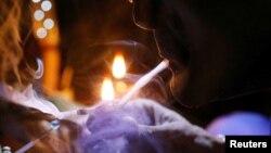  A drug user inhales "shabu," or methamphetamine, at a drug den in Manila, Philippines, Feb. 13, 2017.