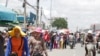 FILE: Workers of garment factories along the Confederation de la Russia Boulevard in Phnom Penh come out during their lunch break. (Khan Sokummono/VOA Khmer)