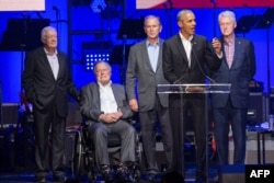 Former US Presidents, Jimmy Carter, George H. W. Bush, George W. Bush, Barack Obama and Bill Clinton attend the Hurricane Relief concert in College Station, Texas, on October 21, 2017.