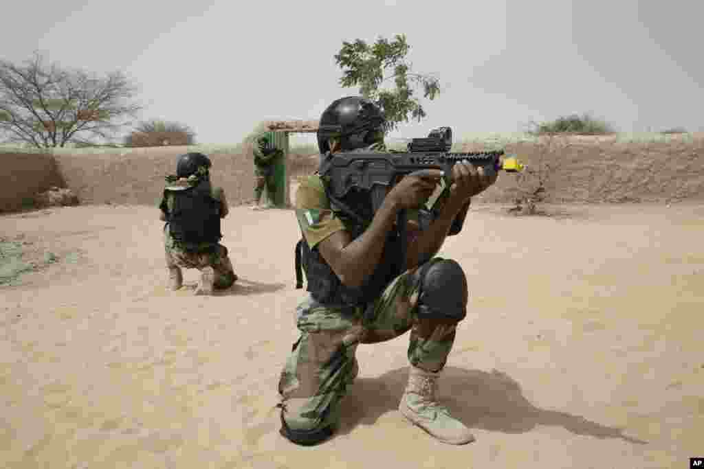 Nigerian special forces guard a compound in a hostage rescue exercise at the end of the Flintlock exercise in Mao, Chad, March 7, 2015.