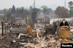 A charred neighborhood destroyed by the Carr Fire is seen west of Redding, California, July 27, 2018.
