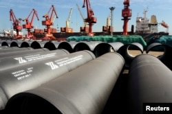 FILE - Steel pipes to be exported are seen at a port in Lianyungang, Jiangsu province, China, May 31, 2018.