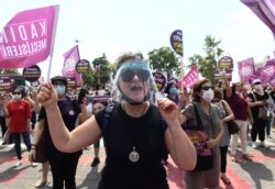 Women march in support of the Istanbul Convention on preventing violence against women, in Istanbul, Sunday, July 19, 2020.