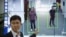 In this Oct. 31, 2018, photo, Huang Yongzhen, CEO of Watrix, demonstrates the use of his firm's gait recognition software at his company's offices in Beijing. 