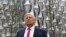 A Madame Tussauds wax figure of US President Donald Trump stands outside the new US Embassy in Embassy Gardens in south-west London on Jan. 12, 2018.