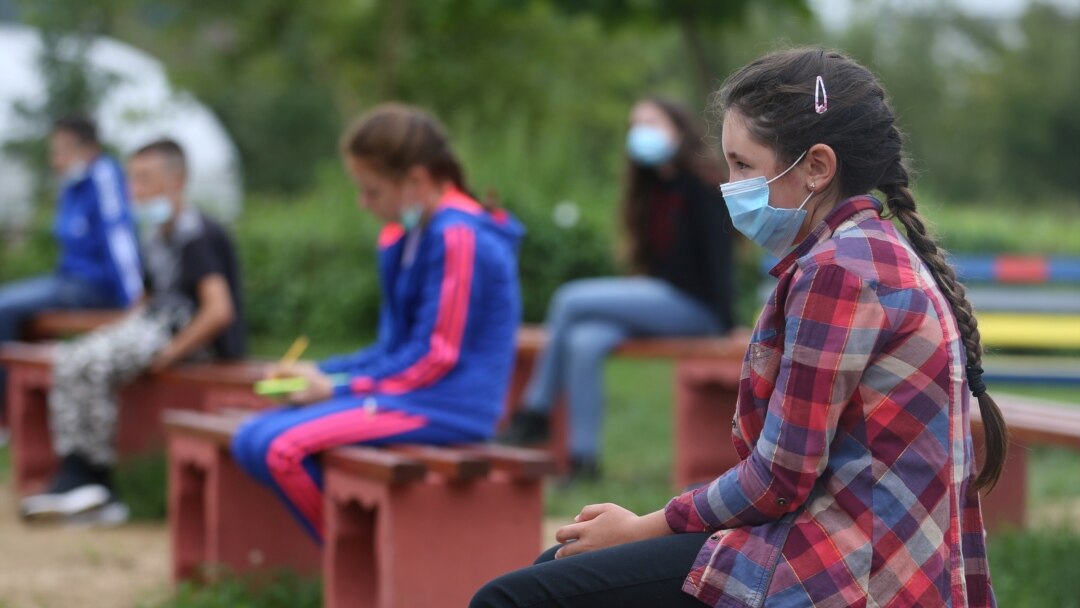 Students attend a class at an elementary school in Kacuni in an open-air classroom, before the start of the school year amid the coronavirus disease (COVID-19) outbreak, in Kacuni, Bosnia and Herzegovina, September 8, 2020. REUTERS/Dado Ruvic