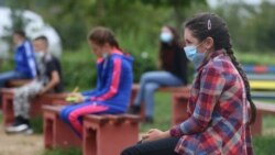 Students attend a class at an elementary school in Kacuni in an open-air classroom, before the start of the school year amid the coronavirus disease (COVID-19) outbreak, in Kacuni, Bosnia and Herzegovina, September 8, 2020. REUTERS/Dado Ruvic