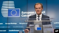 European Council President Donald Tusk speaks during a media conference after an EU summit in Brussels, Dec. 18, 2014. 