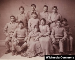 Photo portrait of Chiricahua Apache youths four months after arriving at the Carlisle Indian Industrial School in Carlisle, Pennsylvania.