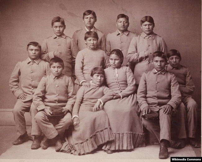 Photo portrait of Chiricahua Apache youths four months after arriving at the Carlisle Indian Industrial School in Carlisle, Pennsylvania.