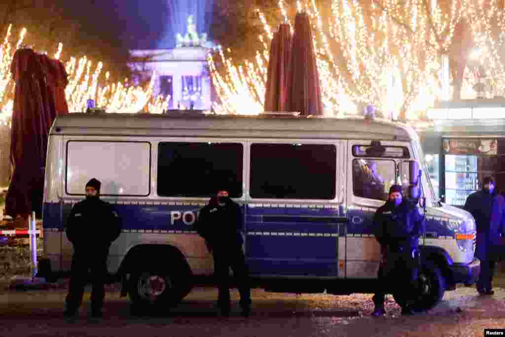 Police secure the area near the Brandenburg Gate on New Year's Eve, amid coronavirus restrictions, in Berlin, Germany, Dec. 31, 2020. 