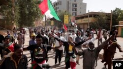 Thousands of people take to the streets in Khartoum, Sudan, Jan. 17, 2022, to protest the Oct. 25, 2021 coup that has plunged the country into grinding deadlock.