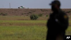 In this Aug. 11, 2017, photo, U.S. a Customs and Border Patrol vehicle patrols along a levee in Granjeno, Texas. Law enforcement officials in the Rio Grande Valley say a border wall is part of their strategy to slow the entry of drugs and illegal immigration. 