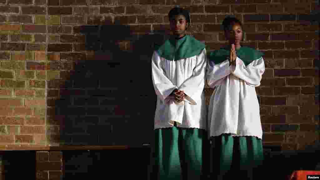 Servers take part in an early morning mass at Regina Mundi Church in Soweto June 30, 2013.