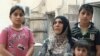 Ibstisam Muhammad, 51, works full time making bread to support her family — she has four children, ages 4 to 18 — even after she was blinded by an Islamic State bombing.