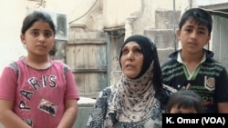 Ibstisam Muhammad, 51, works full time making bread to support her family — she has four children, ages 4 to 18 — even after she was blinded by an Islamic State bombing.