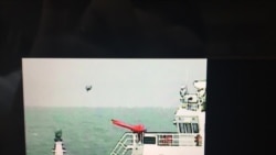 日本海上保安厅公开5月18日在钓鱼岛附近海域拍摄到中国海警船放飞疑似小型无人机的录像（截图）