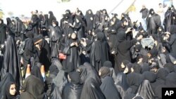 Demonstrators gather near the Pearl Monument on a main square in Manama, Bahrain, February 15, 2011