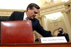 Constitutional law expert George Washington University Law School professor Jonathan Turley arrives to testify during a hearing before the House Judiciary Committee on the constitutional grounds for the impeachment of President Donald Trump.
