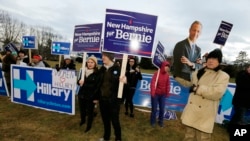 Supporters for Hillary Clinton, Bernie Sanders and Martin O’Malley rally outside the debate hall before the Dec. 19 Democratic presidential debate at Saint Anselm College in Manchester, N.H.