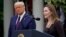 President Donald Trump walks with Judge Amy Coney Barrett to a news conference to announce Barrett as his nominee to the Supreme Court, in the Rose Garden at the White House, Sept. 26, 2020, in Washington. 
