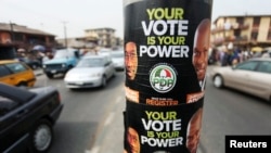 Election posters along a road on the last day of voter registration exercises in Nigeria's commercial capital, Lagos, Feb. 5, 2011 file photo.