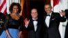 First lady Michelle Obama, left, and President Barack Obama welcome French President François Hollande for a State Dinner at the North Portico of the White House on Tuesday, Feb. 11, 2014.