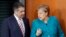 FILE - German Chancellor Angela Merkel, right, and German Foreign Minister Sigmar Gabriel, left, arrive for the weekly cabinet meeting at the Chancellery in Berlin, April 12, 2017.