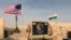 FILE - U.S. and Niger flags fly at the Niger Air Base 201 in Agadez, Niger, April 16, 2018. 
