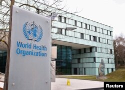 FILE PHOTO: A logo is pictured outside a building of the World Health Organization during an executive board meeting on update on the coronavirus outbreak, in Geneva, Feb. 6, 2020.