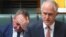 FILE - Australian Deputy Prime Minister Barnaby Joyce reacts as he sits behind Australian Prime Minister Malcolm Turnbull in the House of Representatives at Parliament House in Canberra, Australia, Oct. 24, 2017.
