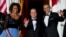First lady Michelle Obama, left, and President Barack Obama welcome French President François Hollande for a State Dinner at the North Portico of the White House on Tuesday, Feb. 11, 2014.