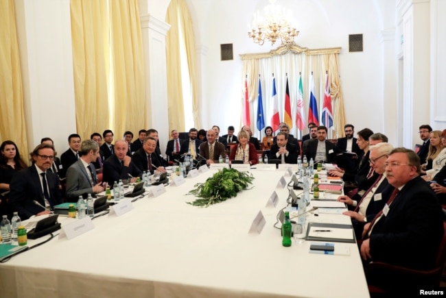 FILE - Iran's top nuclear negotiator Abbas Araqchi and Secretary General of the European External Action Service (EEAS) Helga Schmid attend a meeting of the JCPOA Joint Commission in Vienna, Austria, June 28, 2019.