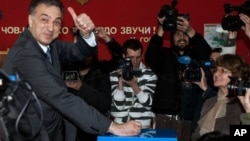 Presidential candidate and Montenegrin President Filip Vujanovic casts ballot at polling station in Podgorica, April 7, 2013.