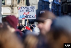 People take part in a demonstration against racism and far right politics in Erfurt, Germany, on Jan. 20, 2024.