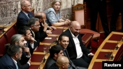 FILE - lawmakers of the extreme-right Golden Dawn party are seen in parliament in Athens October 7, 2013.