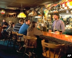 Owner Murray McGrath tends bar McGrath's Irish Pub at the Inn at Long Trail.