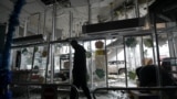 A man walks inside a damaged store following shelling, which local officials called a Ukrainian military strike, in Donetsk, Russian-controlled Ukraine, on Jan. 10, 2025.