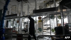 A man walks inside a damaged store following shelling, which local officials called a Ukrainian military strike, in Donetsk, Russian-controlled Ukraine, on Jan. 10, 2025.