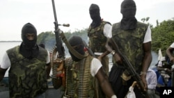 Members of Movement for the Emancipation for the Niger Delta, (MEND) a militant group patrol the creeks in the Niger Delta area of Nigeria