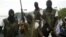 Members of Movement for the Emancipation for the Niger Delta, (MEND) a militant group patrol the creeks in the Niger Delta area of Nigeria