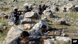 Recruits of PJAK, the Party for a Free Life in Kurdistan, a splinter group of the PKK, the Kurdistan Workers Party, take defensive positions near the PJAK training camp in the Kandil mountain range, northern Iraq (File)