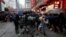 A riot police officer clashes with a protester during an anti-government rally in central Hong Kong, China October 6, 2019.