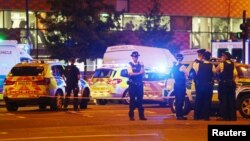 Police officers attend to the scene after a vehicle collided with pedestrians in the Finsbury Park neighborhood of North London, Britain, June 19, 2017.