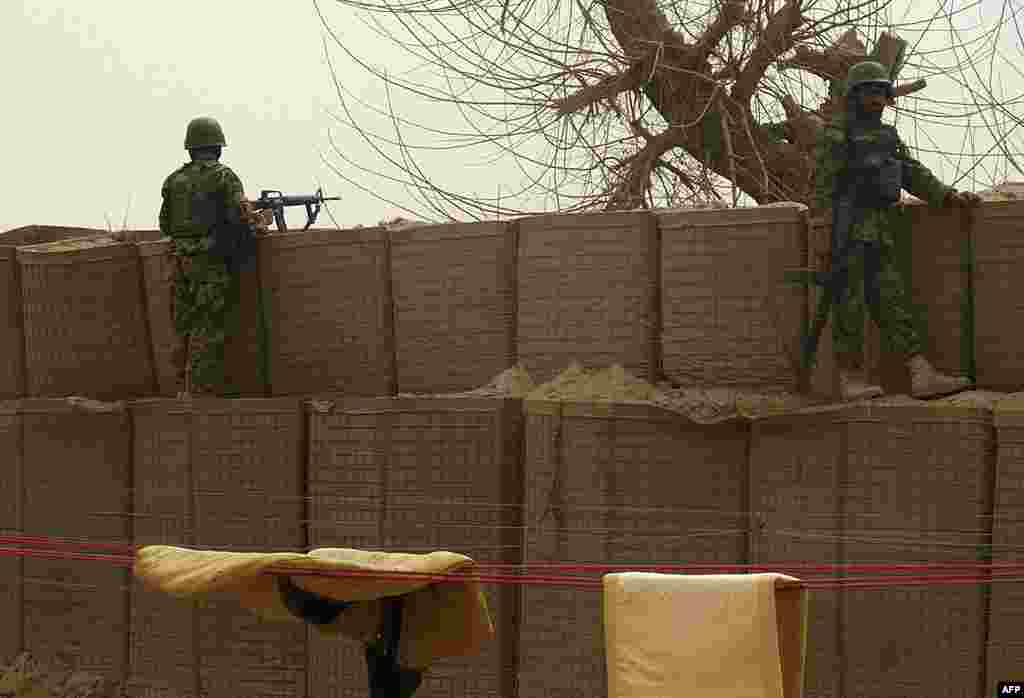 Afghan National Army soldiers keep watch inside a U.S. base in Panjwai. (AP) 