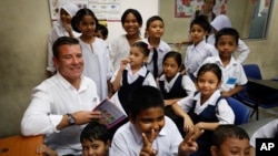 New Zealand Immigration Minister Michael Woodhouse visits to the UNHCR Tzu Chi Education Centre in Selayang, outskirts of Kuala Lumpur, Malaysia. New Zealand announced, April 19, 2017, that it is introducing tougher requirements for skilled overseas workers as it tries to control immigration numbers that have reached an all-time high. 